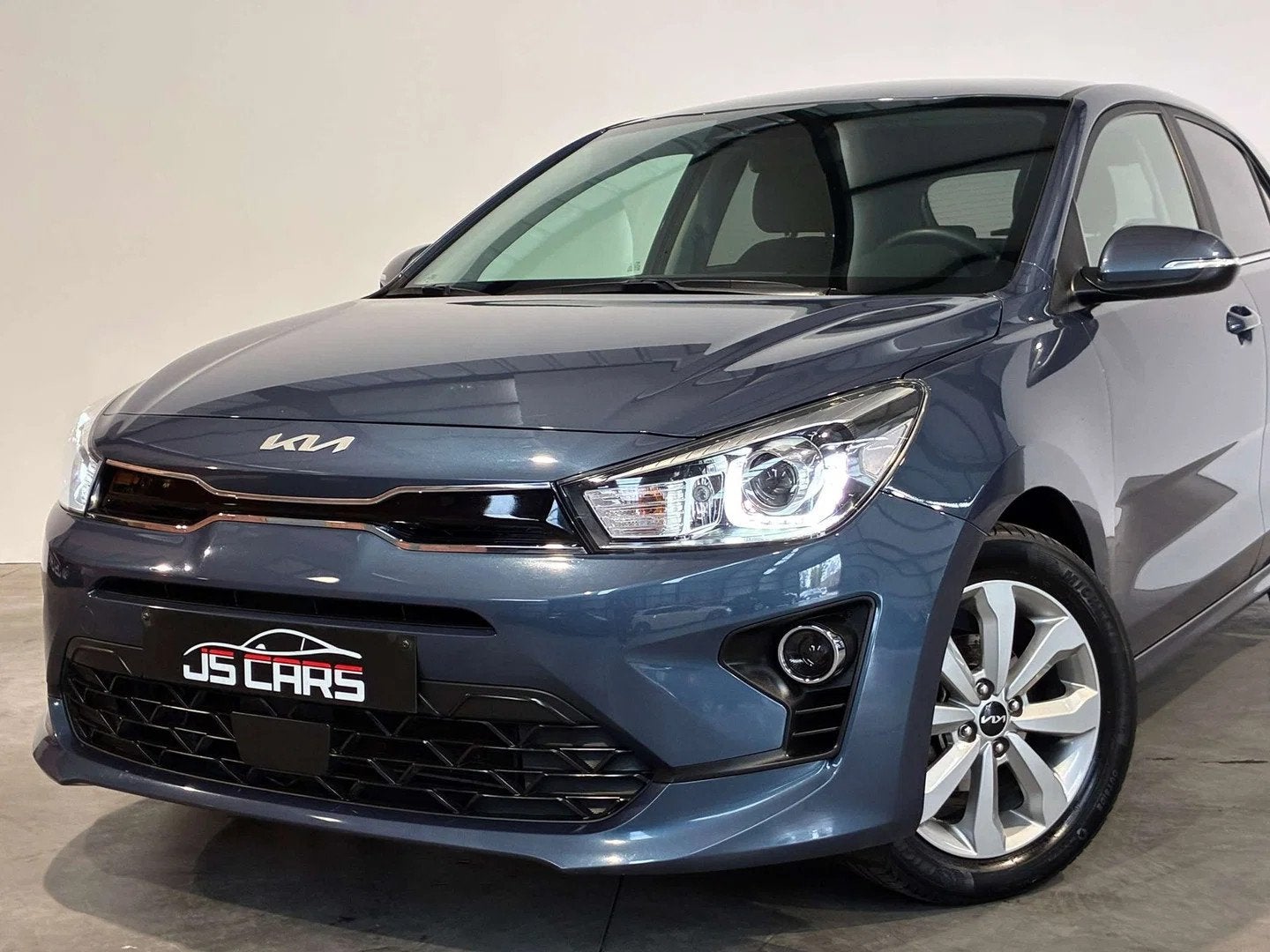 Kia Rio 1.2i Pulse 1ERPRO-GPS-CARPLAY-CAMERA-JANTES16-PDC, Auto's, Stof, Gebruikt, 4 cilinders, Blauw