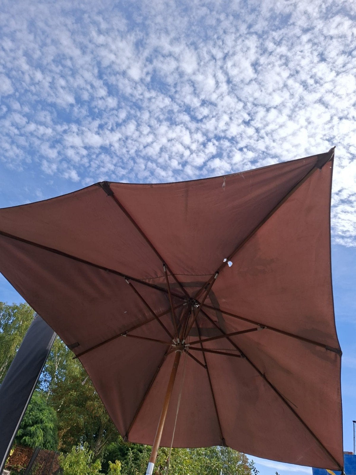 parasol met voet, Ophalen