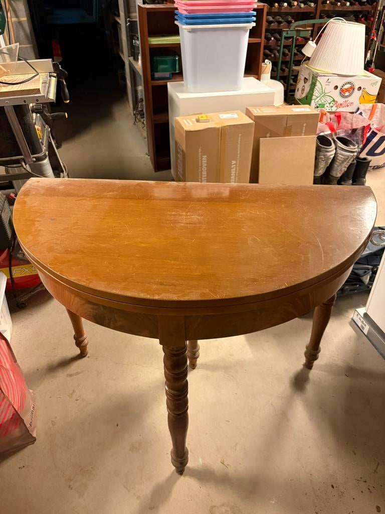 Table demi lune ronde, Ophalen
