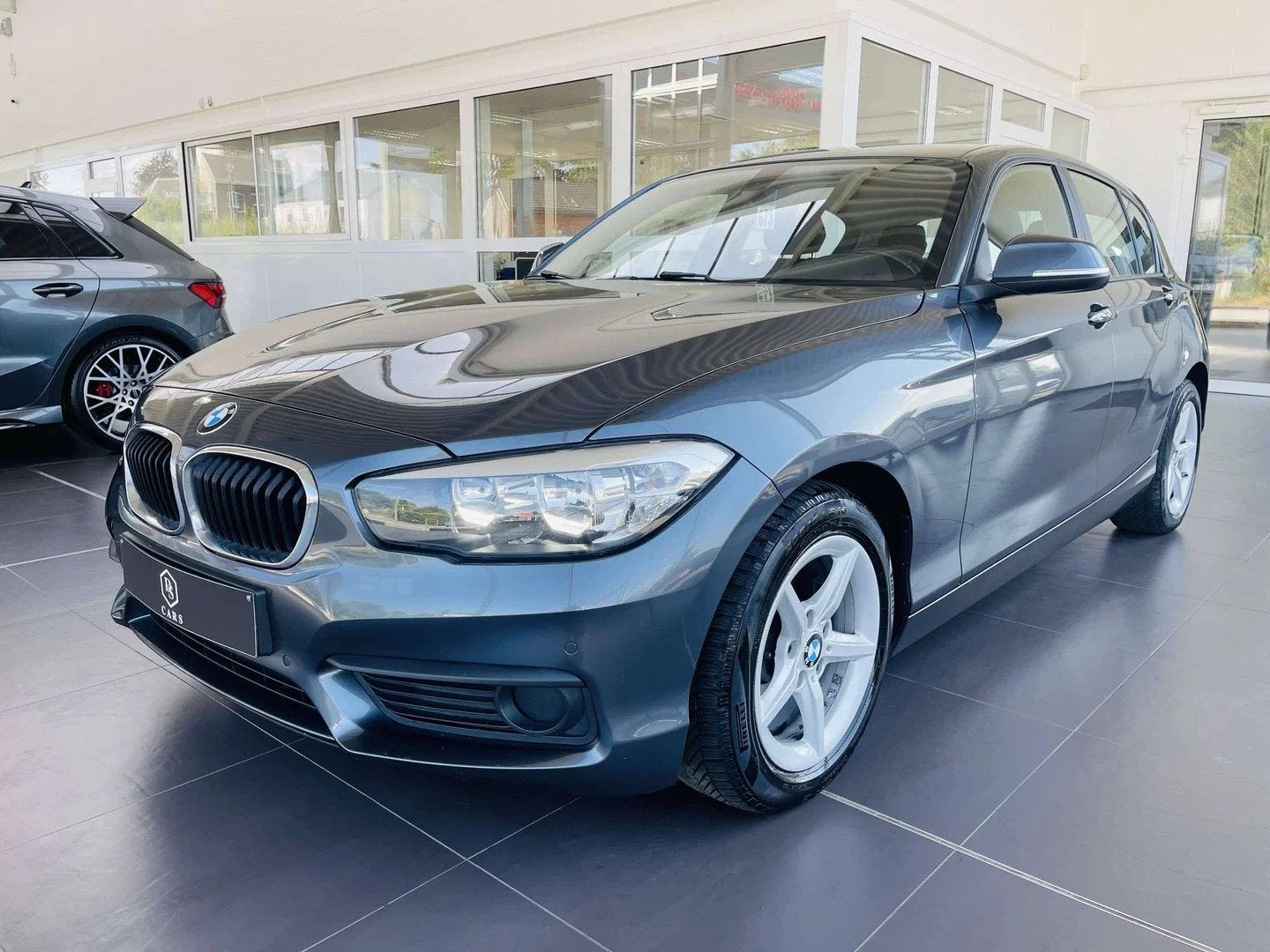 BMW 1 Serie 118 iA * GARANTIE + GPS + AIRCO * (bj 2019), Auto's, BMW, Gebruikt, Euro 6, 1885 kg, 136 pk