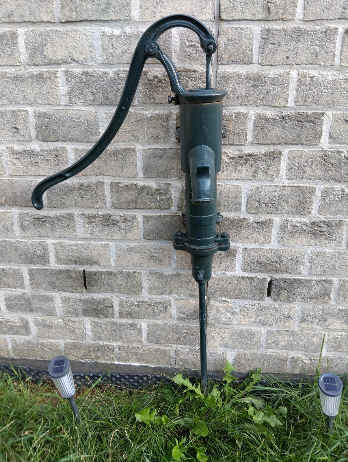 oude gietijzeren waterpomp, Ophalen