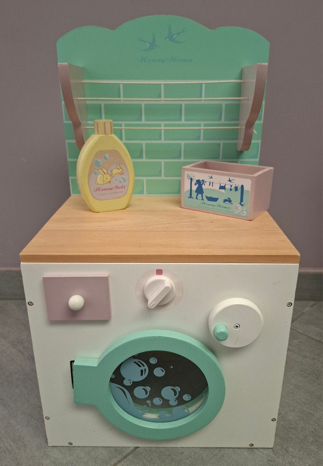Le Toy Van Honeybake wasmachine, Ophalen