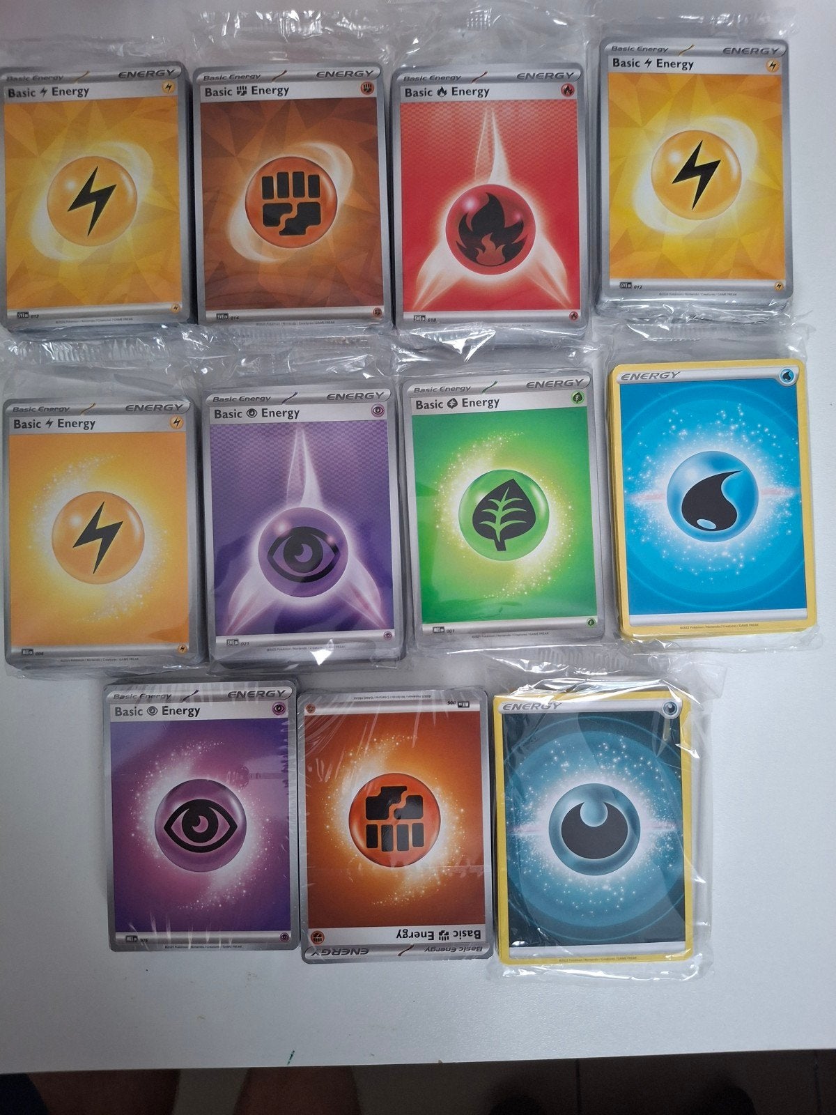 Sealed pakjes energie kaarten van verschillende sets, Hobby en Vrije tijd, Ophalen of Verzenden