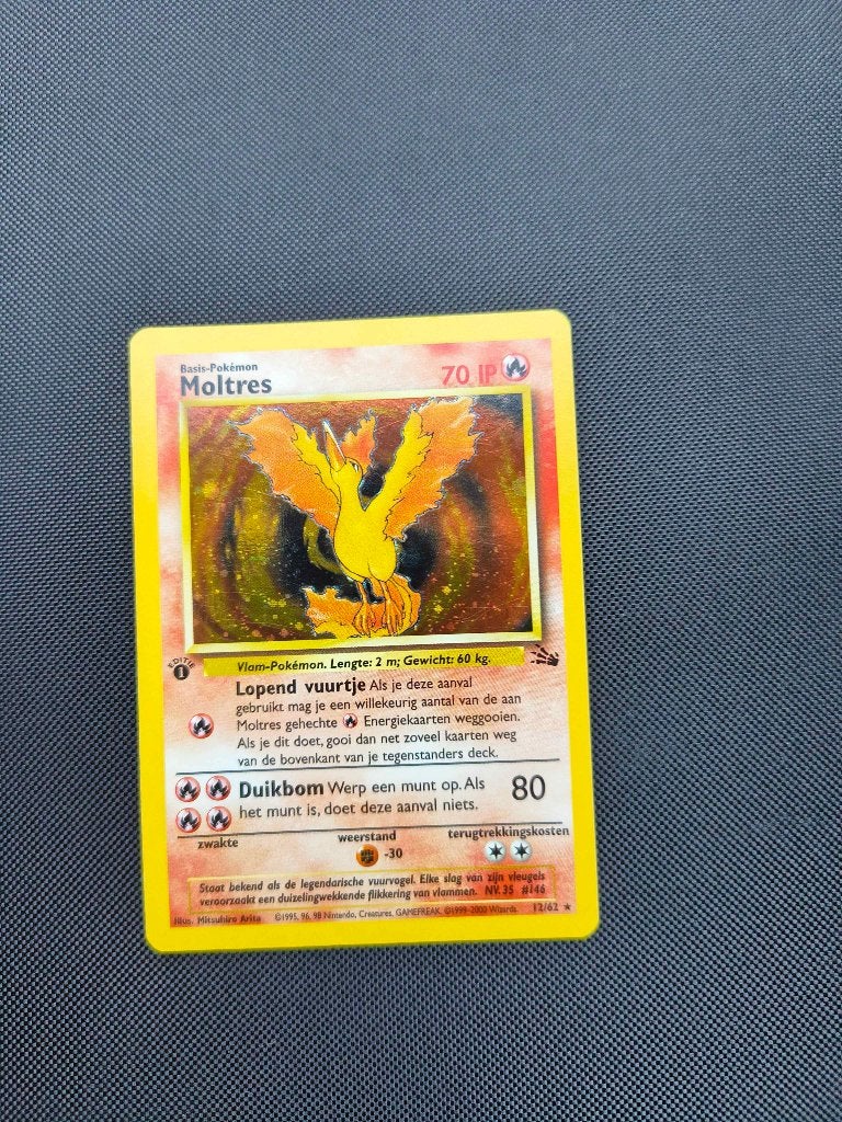 Pokemon Moltres 1edition Jungle Nederlands, Ophalen of Verzenden, Zo goed als nieuw, Losse kaart, Foil