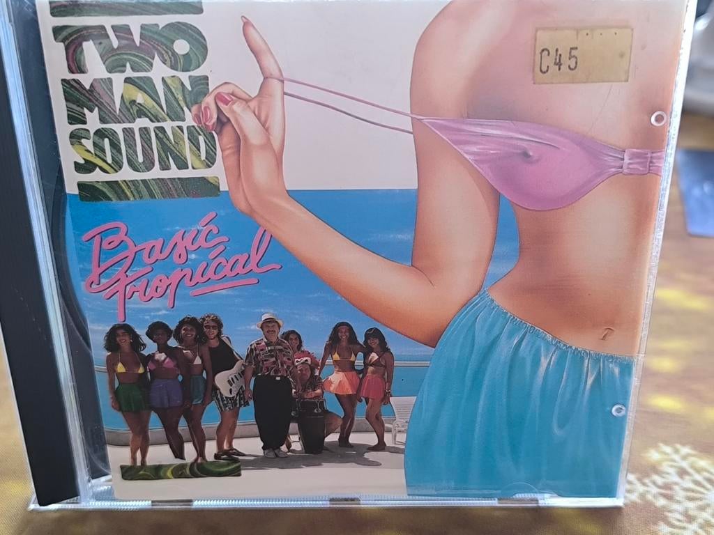 CD Two Man Sound, Basic Tropical (1990), Cd's en Dvd's, Ophalen of Verzenden, Zo goed als nieuw