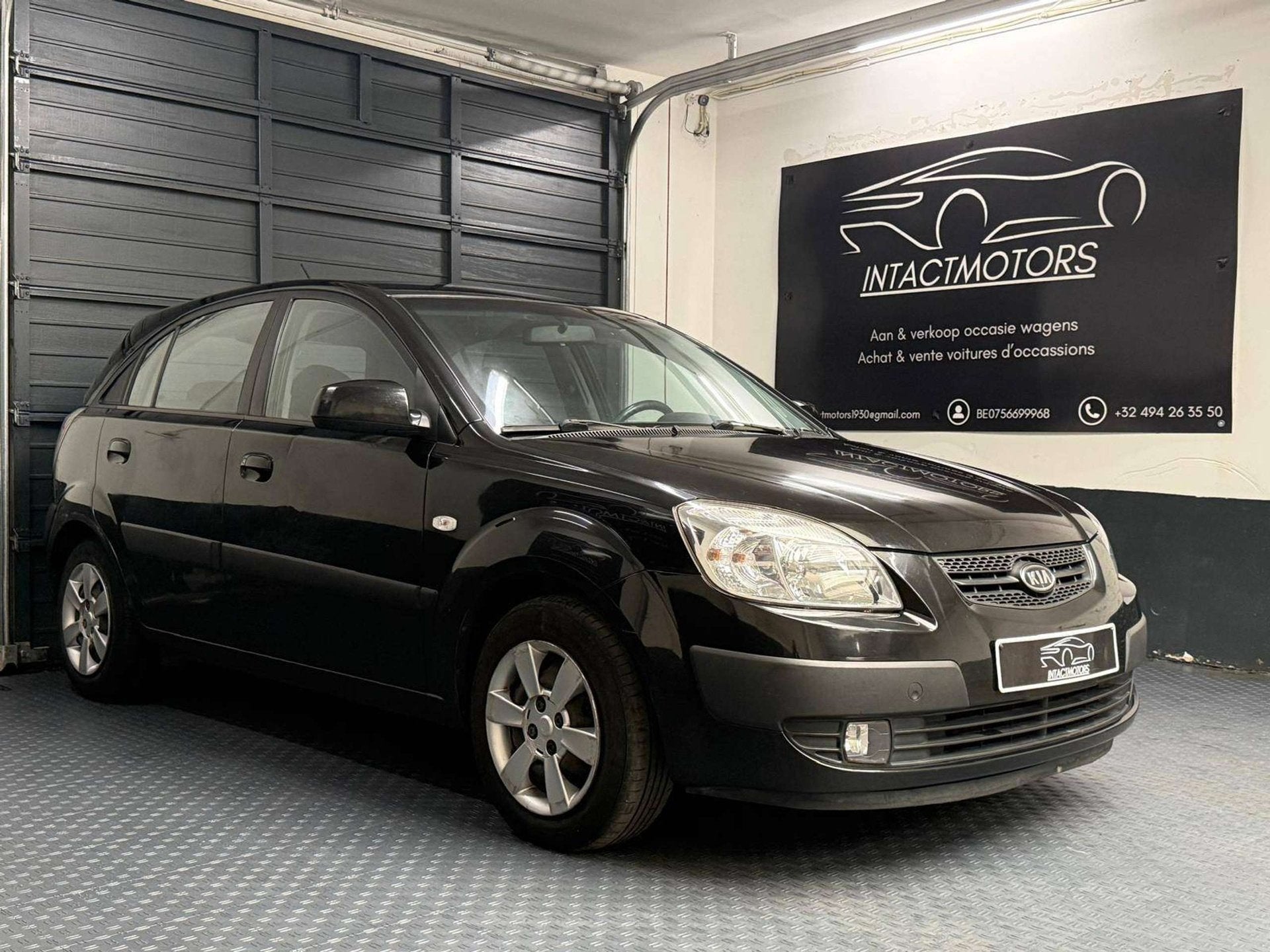 Kia Rio 1.4i LX Airco, Autos, Entreprise, Capteur de stationnement, Boîte manuelle, Noir
