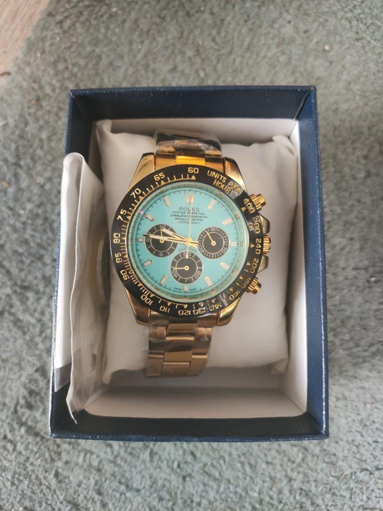 Goudkleur Rolex  daytona met turkoois blauw wijzerplaat, Staal, Polshorloge, Nieuw, Ophalen of Verzenden