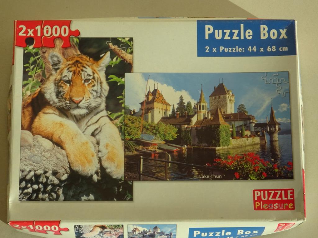 2 puzzels 1000 st Lake Thun en tijger 4 + 1 gratis, Ophalen of Verzenden, 500 t/m 1500 stukjes, Zo goed als nieuw, Legpuzzel
