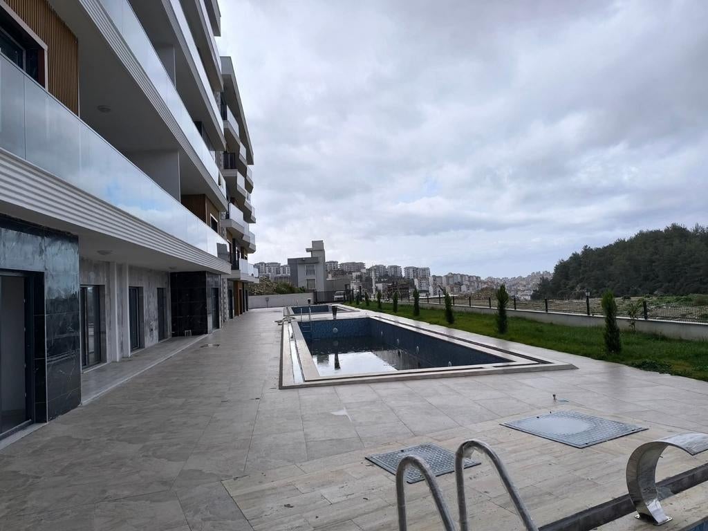 A vendre Appartement 1+1 à Kuşadası İkiçeşmelik, Immo, 55 m², Stad, Appartement, 1 kamers