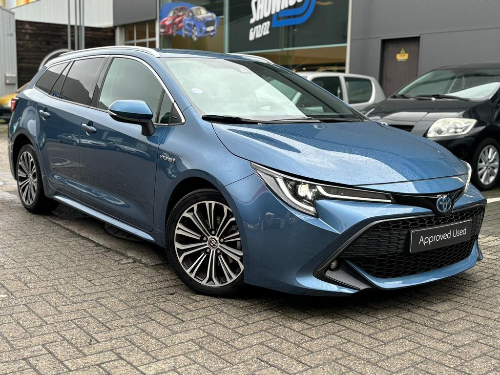 Toyota Corolla Touring Sport 1.8 VVT-I Hybride Style, Auto's, Stof, 4 cilinders, Blauw, Corolla