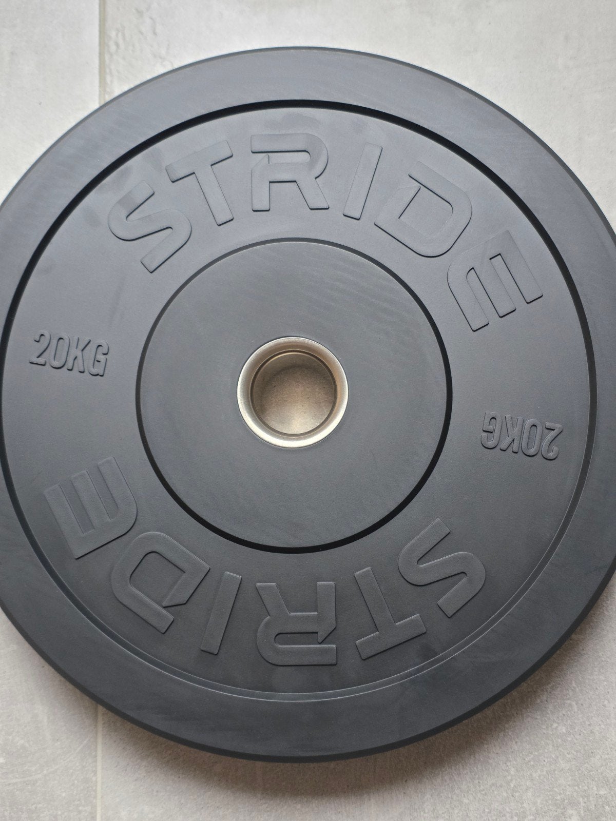 NEW STRIDE Bumperschijf 20 kg — zwart rubber — Ø50 mm, Sport en Fitness, Fitnessmaterialen, Ophalen of Verzenden, Nieuw, Benen