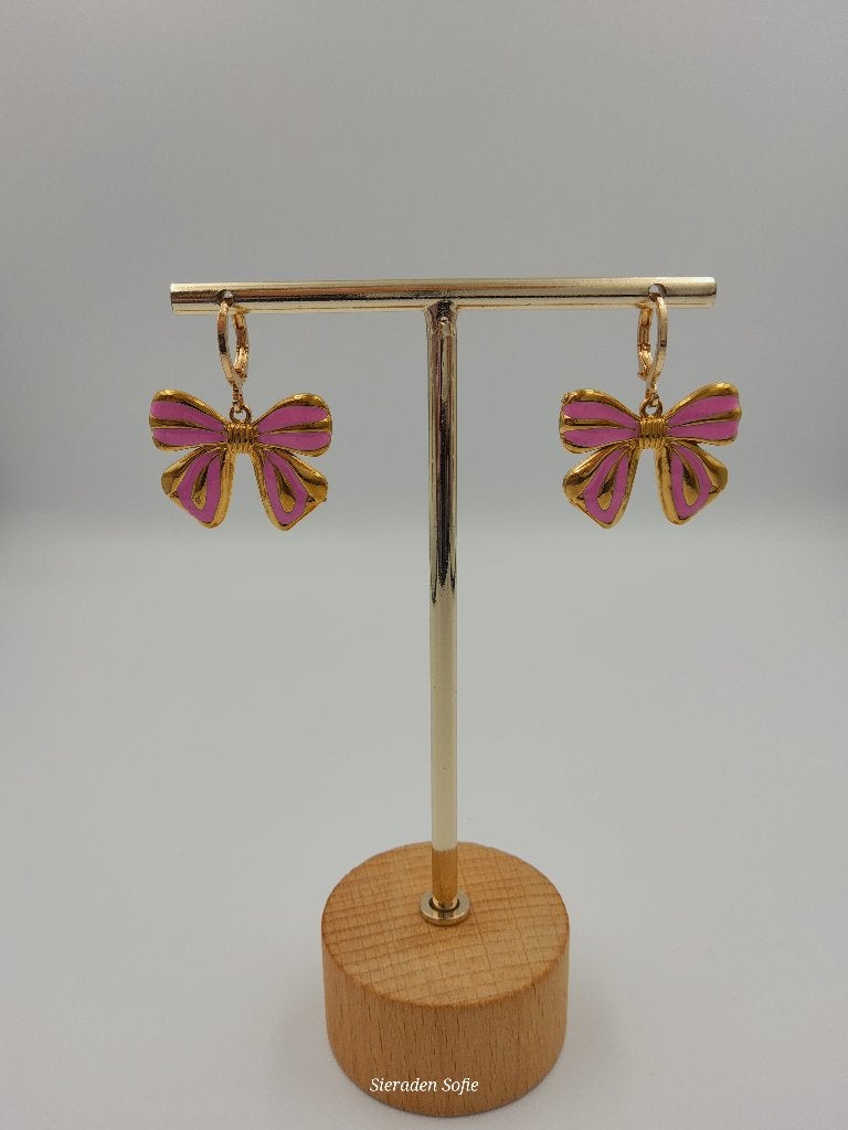 Oorbellen strikje, Handtassen en Accessoires, Kettingen, Ophalen of Verzenden, Nieuw, Roze