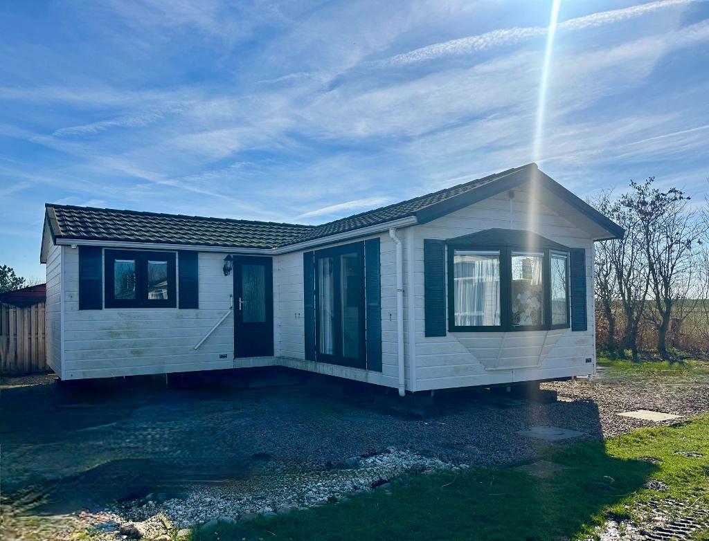 Kunststof L- Chalet dubbelglas inclusief transport NL, Caravans en Kamperen, Stacaravans, tot en met 2, Verzenden