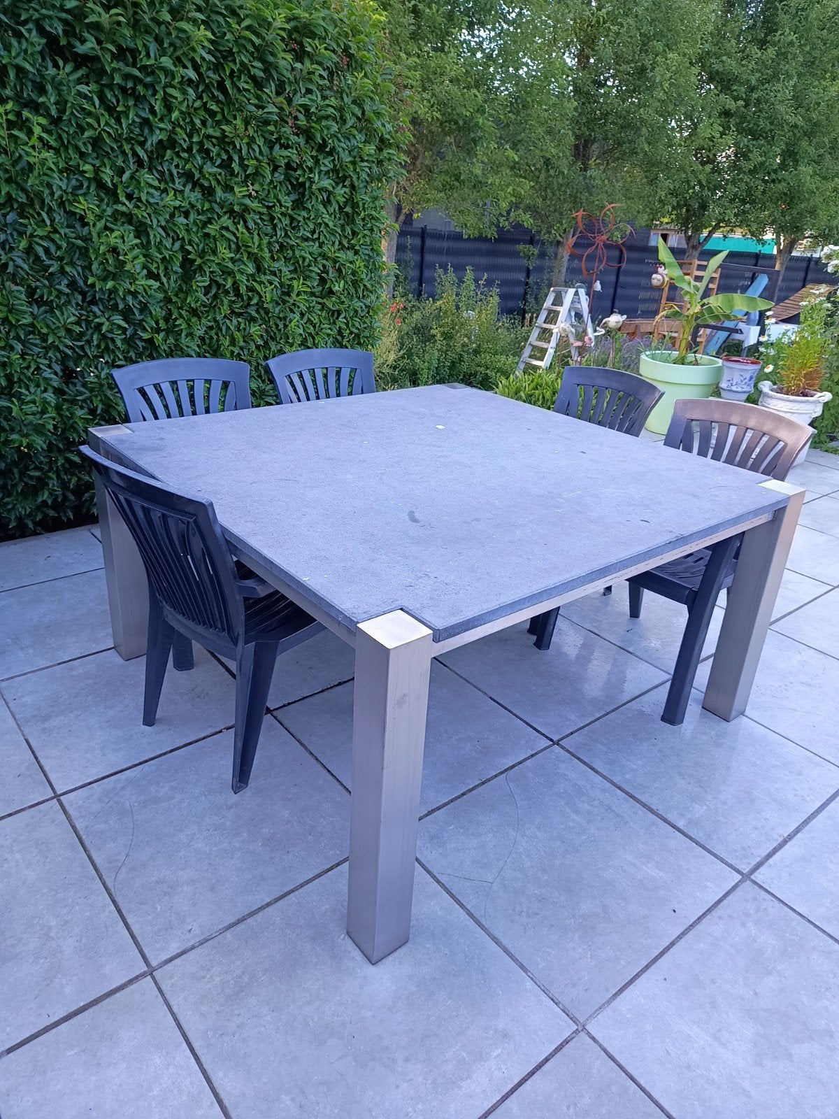 Tuintafel (inox/natuursteen), Ophalen