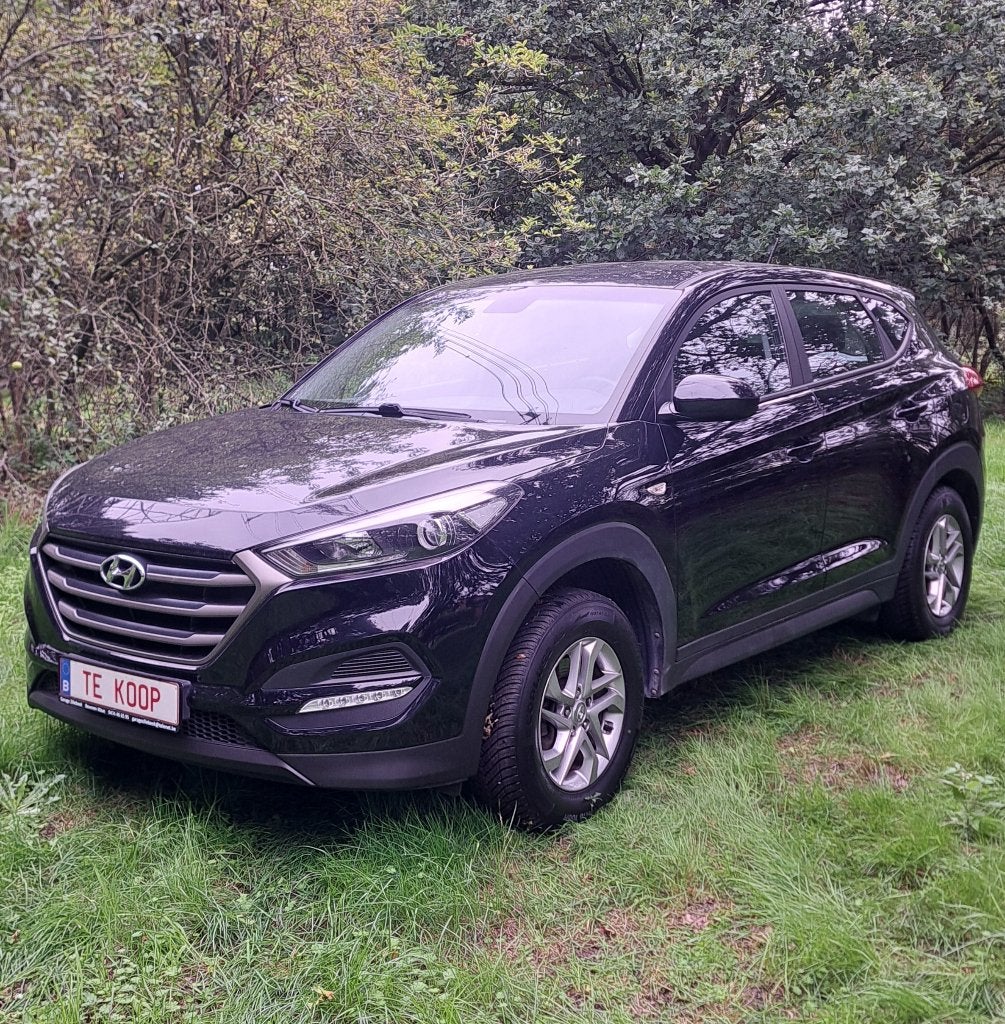 Hyundai Tucson: 59.000km + airco +garantie + groot nazicht!, Voorwielaandrijving, Stof, 4 cilinders, Zwart