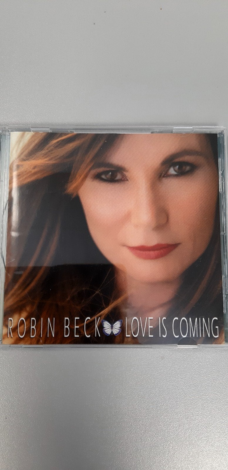 CD ROBIN BECK, L'amour arrive, Enlèvement ou Envoi, Comme neuf