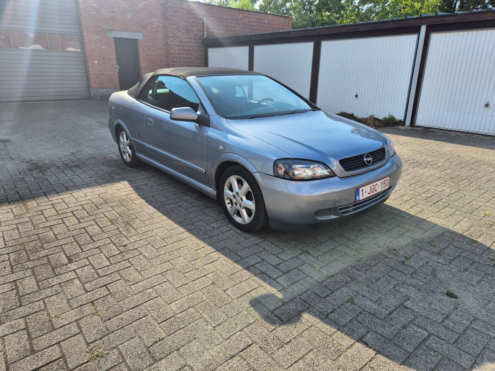 opel astra cabrio, Auto's, Voorwielaandrijving, 4 zetels, Stof, Zwart