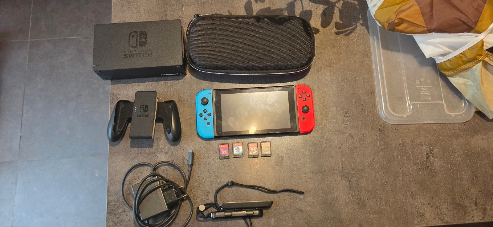 nintendo switch met 4 games, Ophalen