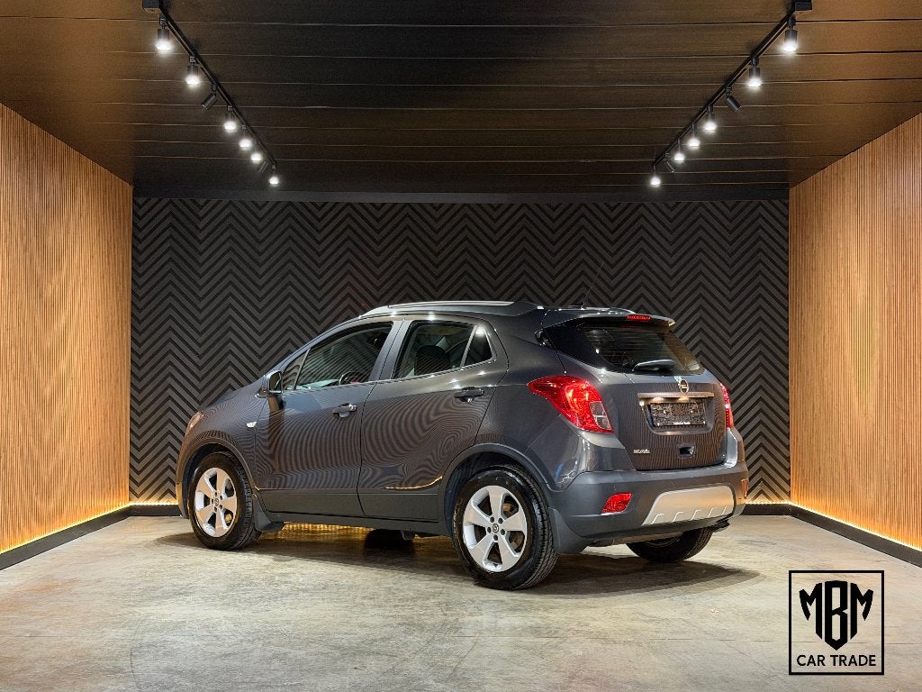 ✅Opel Mokka 1.6i GARANTIE Airco Navi CruiseC Parksensor 1Eig, Auto's, Dealer onderhouden, Stof, 4 cilinders, 5 deurs