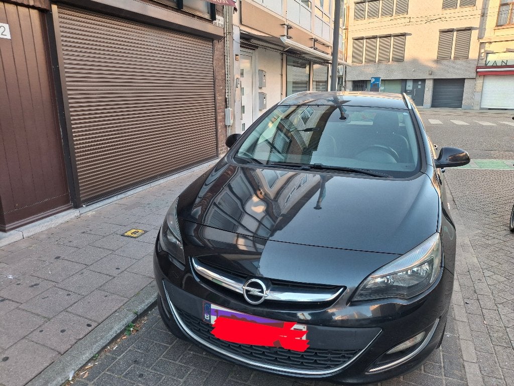 Opel Astra Sports Tourer 1.6 Diesel, Auto's, Euro 6, Leder en Stof, Zwart, Particulier