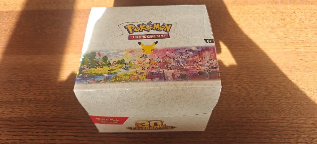 Pokémon 30 celebration mini tin display, Hobby en Vrije tijd, Verzenden, Nieuw, Boosterbox, Foil