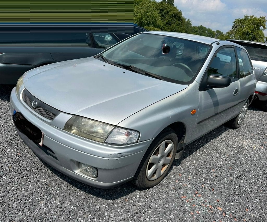 Mazda 323 1.5Benzine Automaat 2000, Auto's, Stof, Particulier, Zilver of Grijs, Multifunctioneel stuurwiel