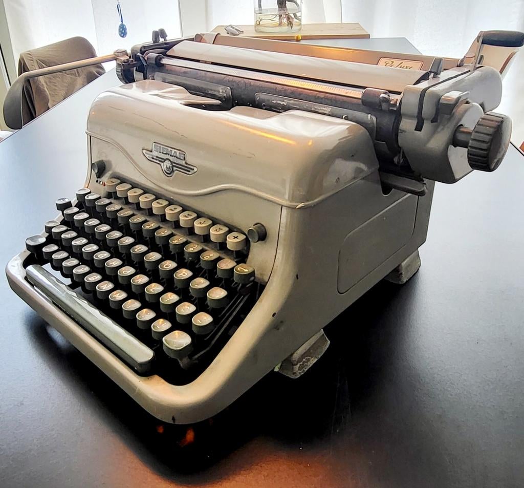 Gietijzeren typmachine van Siemag De Luxe, Ophalen