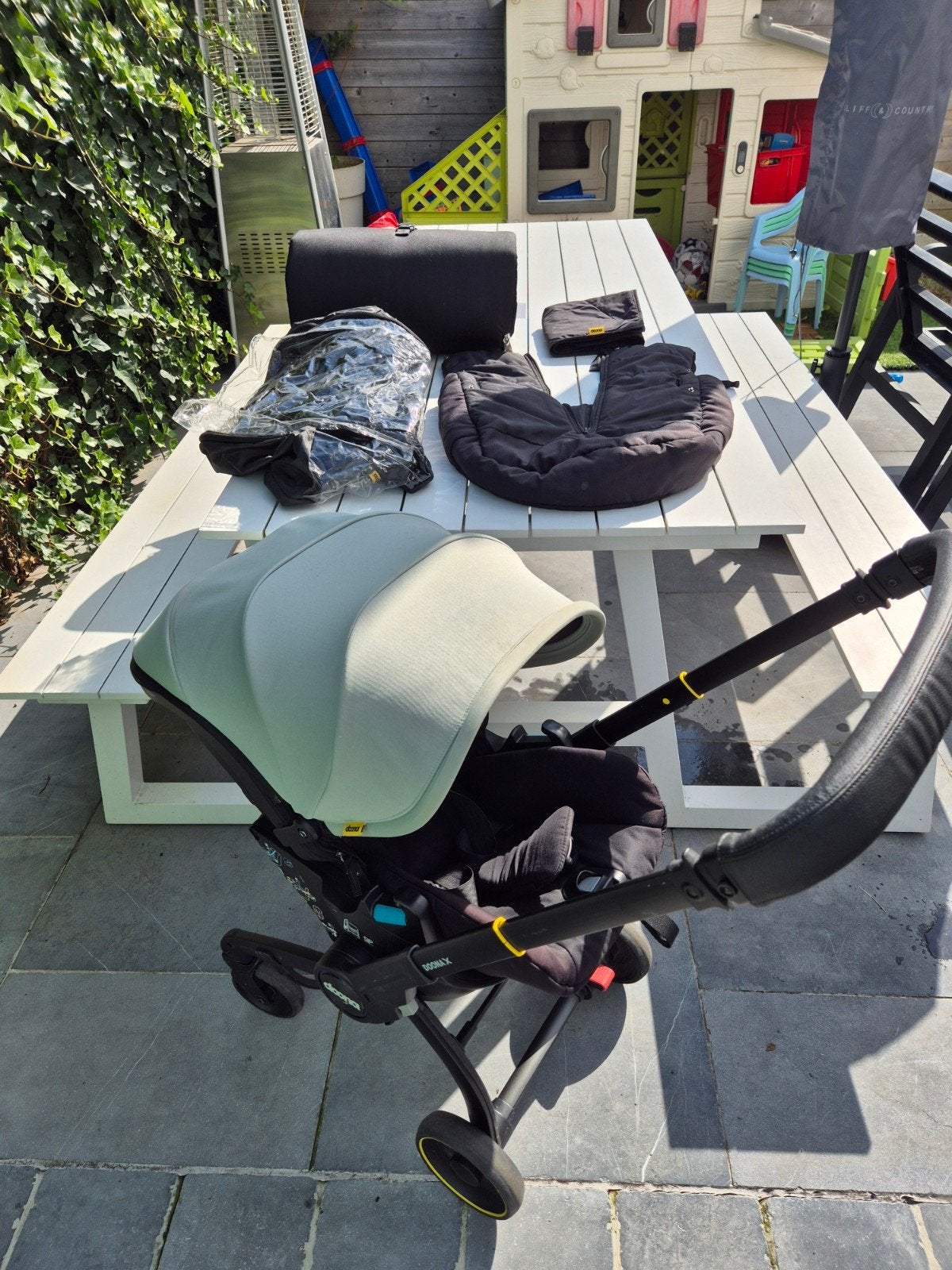 Doona X Dusty Sage + Isofix en accessoires, Gebruikt, Met autostoeltje, Combiwagen, Ophalen