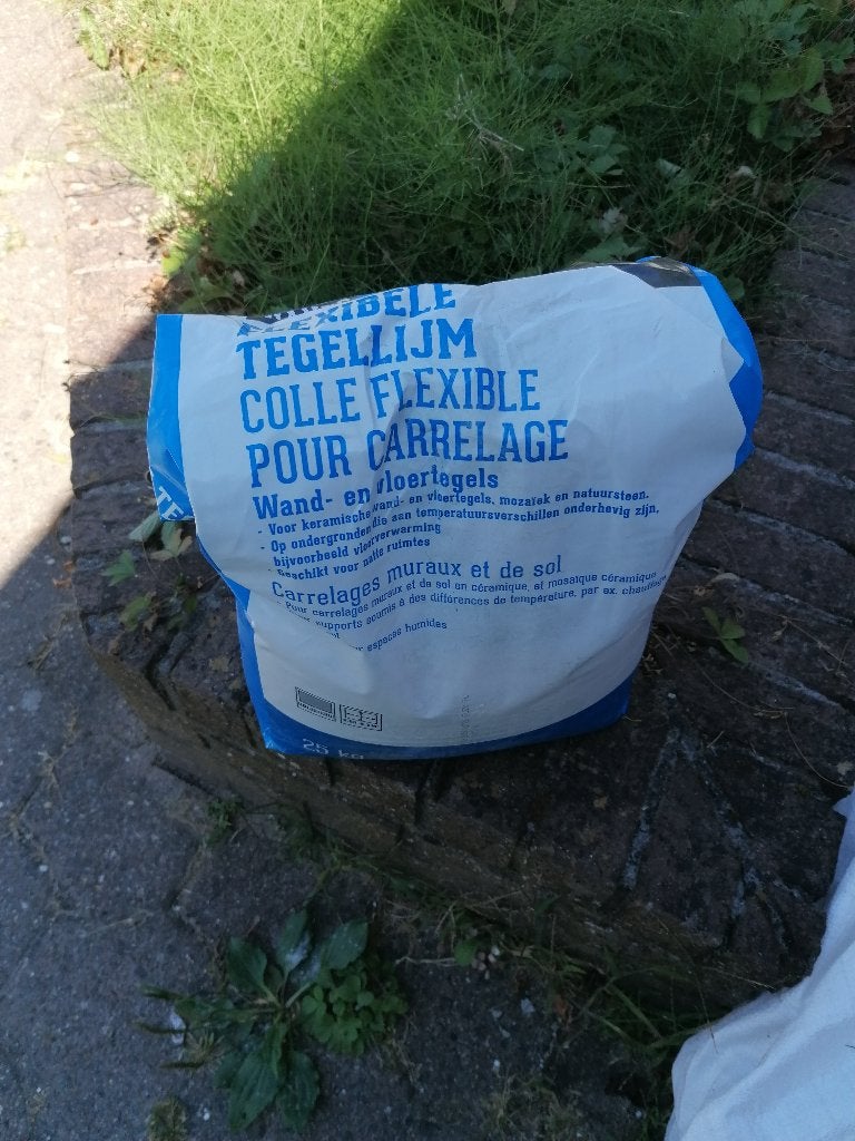Flexibele tegellijm grijs, Doe-het-zelf en Bouw, Ophalen, Nieuw