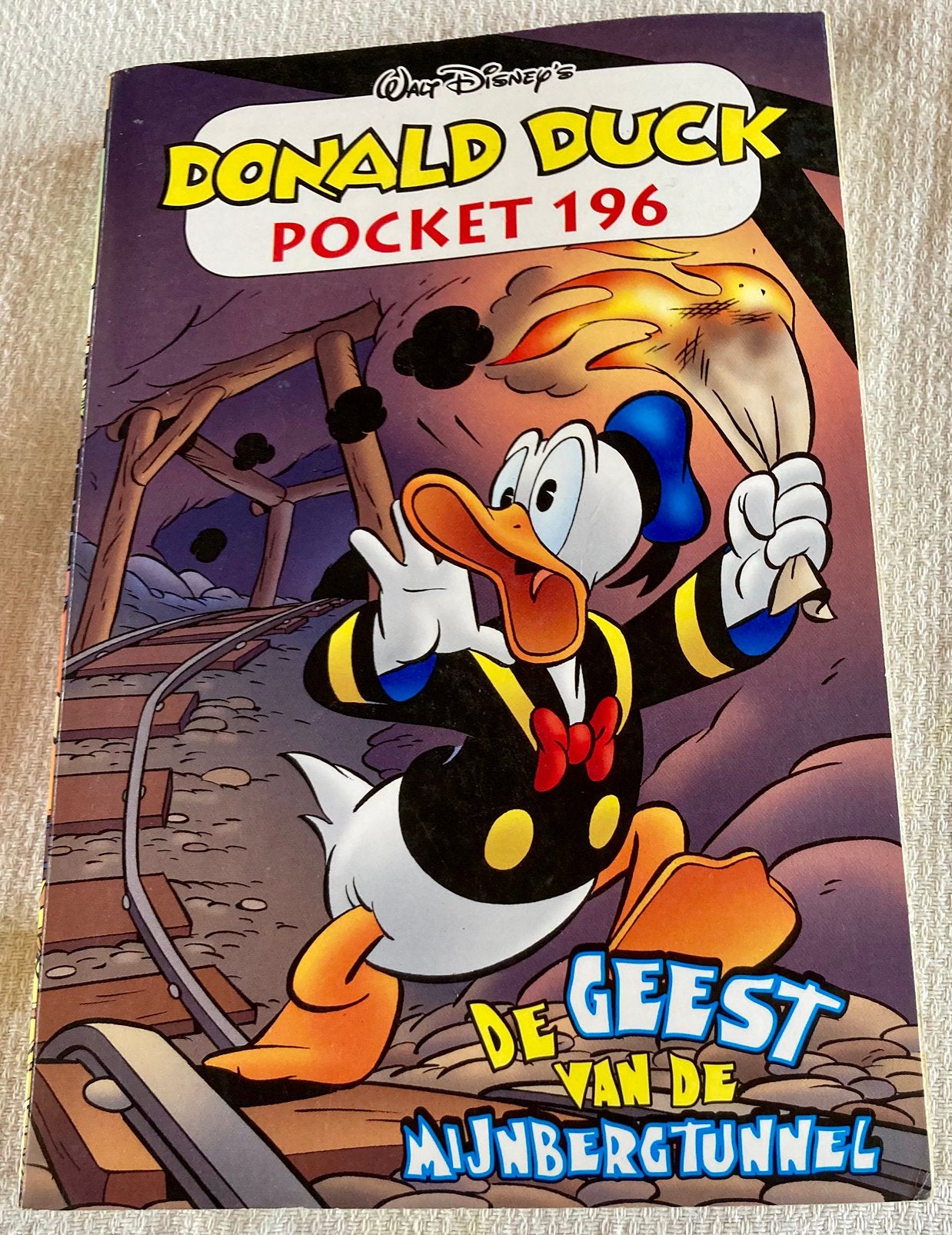 Walt Disney - De geest van de Mijnbergtunnel, Boeken, Ophalen of Verzenden, Zo goed als nieuw, Walt Disney