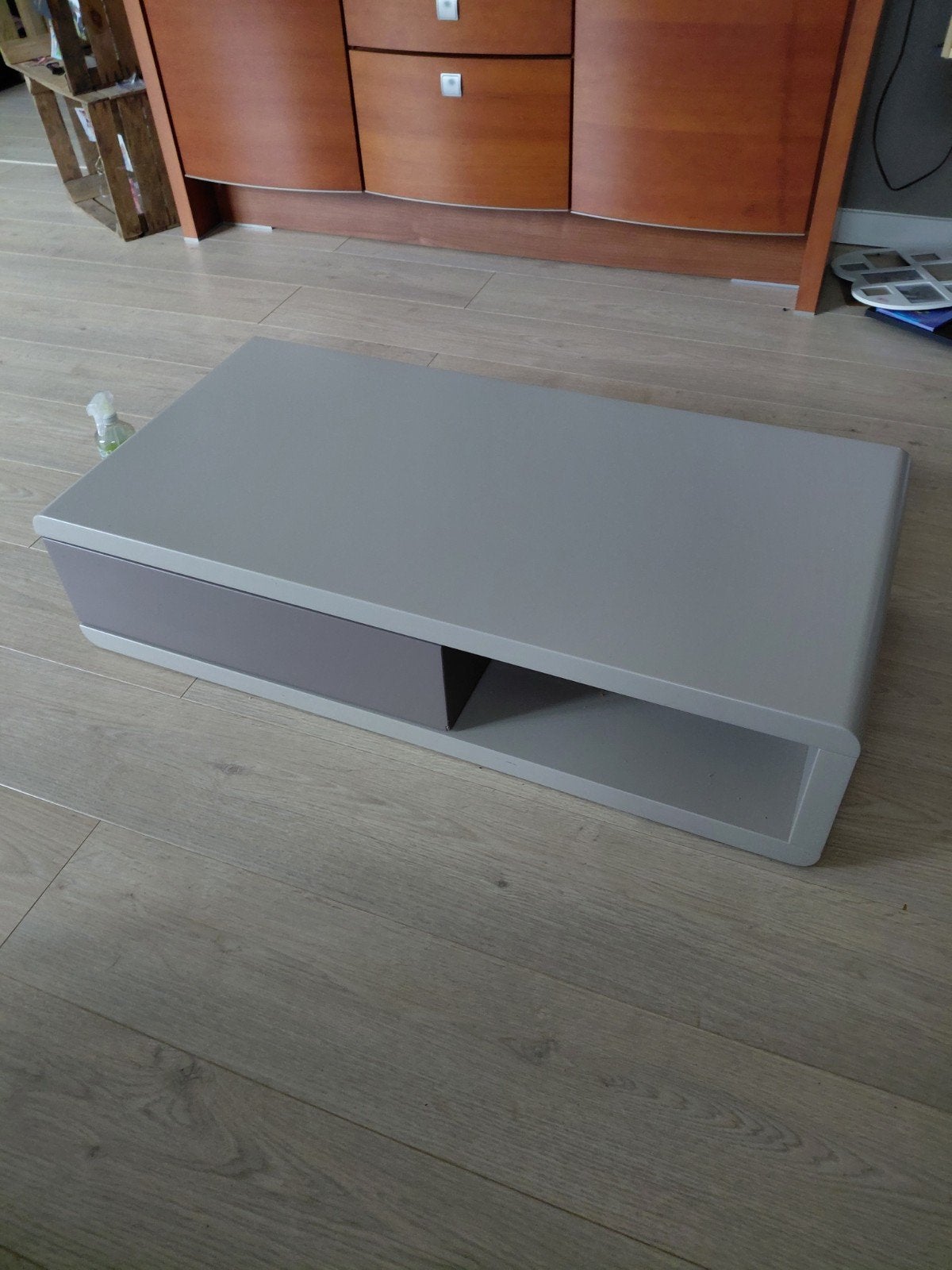 grijze salontafel met draaischuif, Enlèvement