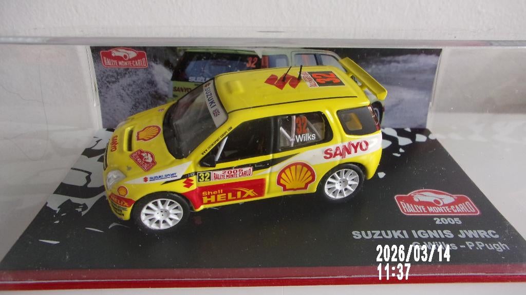 SUZUKI IGNIS JWRC. WILKS M-C 05.IXO 1/43 COMME NEUVE., Enlèvement ou Envoi, Comme neuf, Voiture, Autres marques