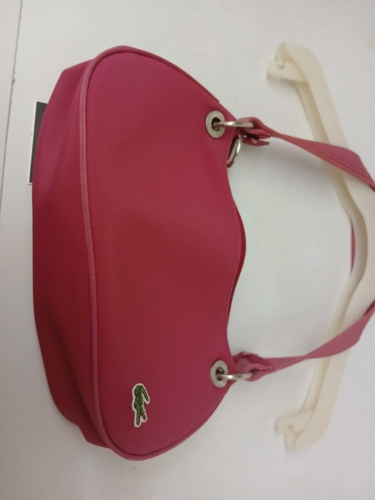 Handtasje lacoste, Enlèvement
