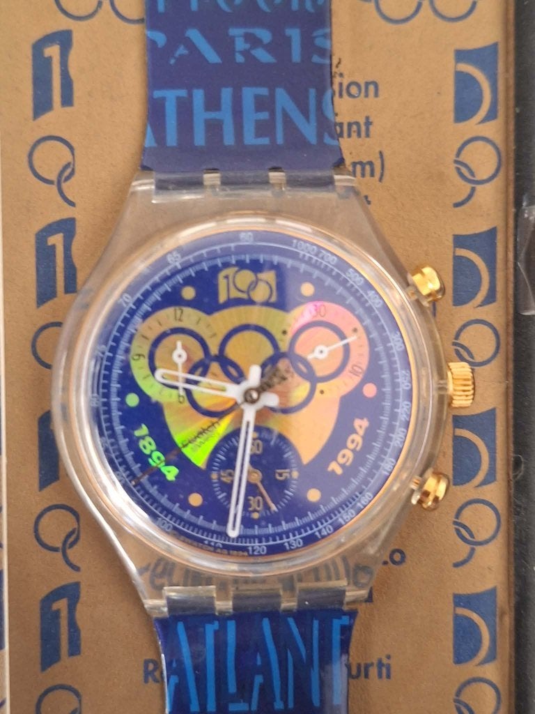 Montre Swatch Chrono IOC 1994 Olympique SCZ101, Bijoux, Sacs & Beauté, Enlèvement ou Envoi, Autres matériaux, Bracelet
