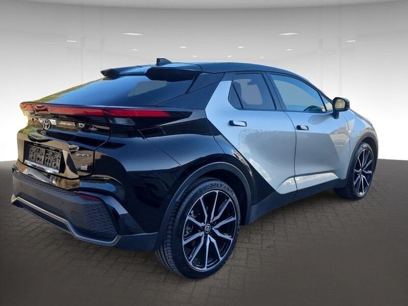 Toyota C-HR Hybrid 2WD e-CVT GR Sport Bi-Tone, Gebruikt, Zwart, 4 cilinders, Leder en Stof