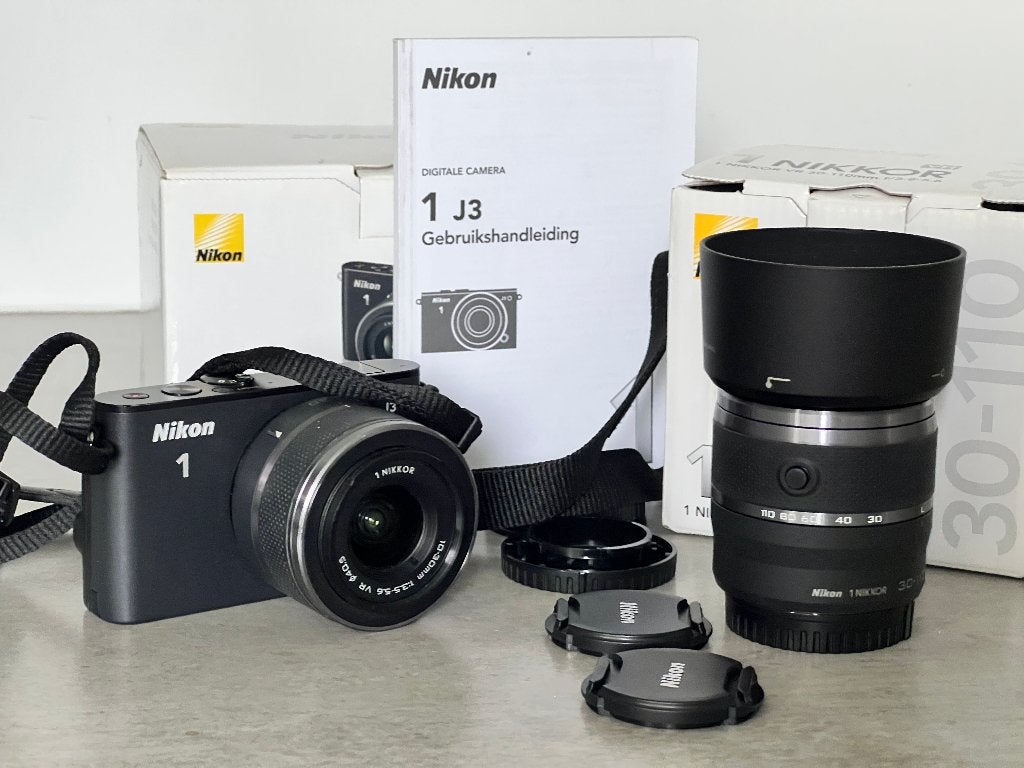 NIKON 1 met  Lenzen 30-110 & 10-30 Wide, normaal & tele, Nikon, Ophalen of Verzenden, Zo goed als nieuw, Zonnekap