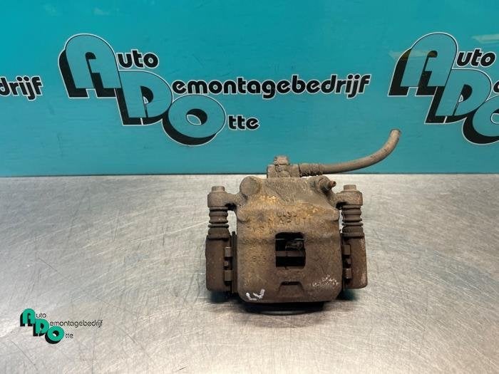Remklauw (Tang) links-voor van een Suzuki Alto (Alto 02-), Gebruikt, -, -, Ophalen of Verzenden
