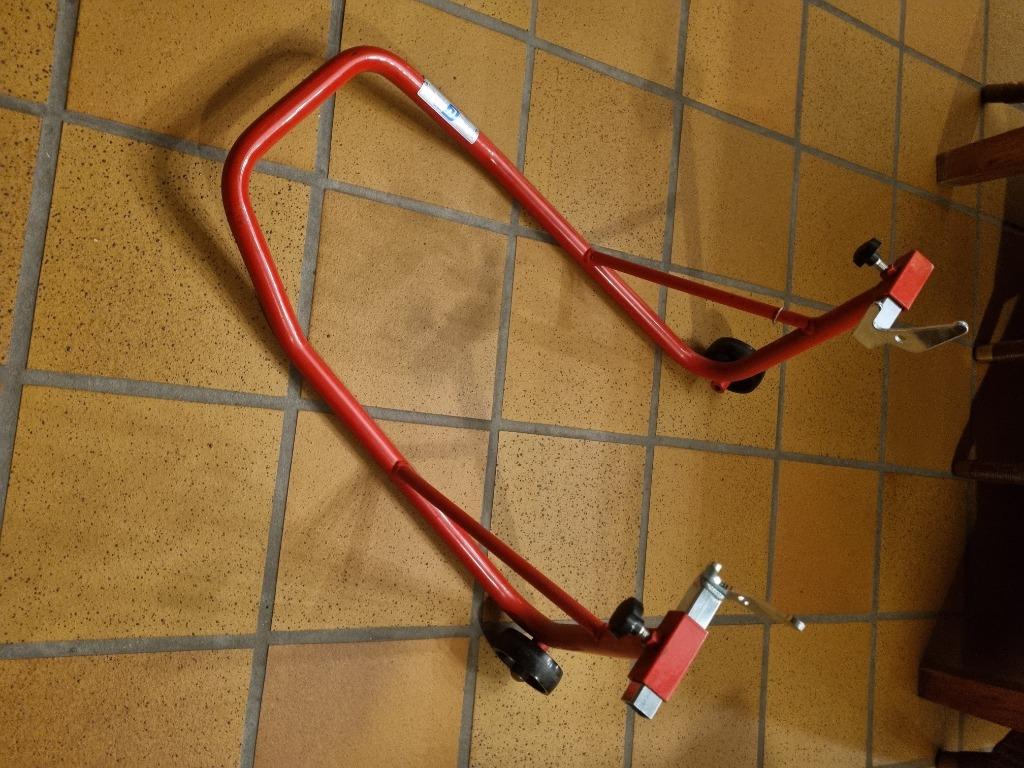 Paddock steun achter, Motoren, Ophalen
