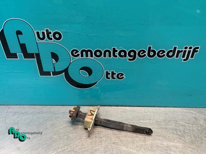 Butée 4portes arrière gauche d'un Daihatsu Cuore (Cuore 03, Daihatsu, -, 3 mois de garantie, Utilisé