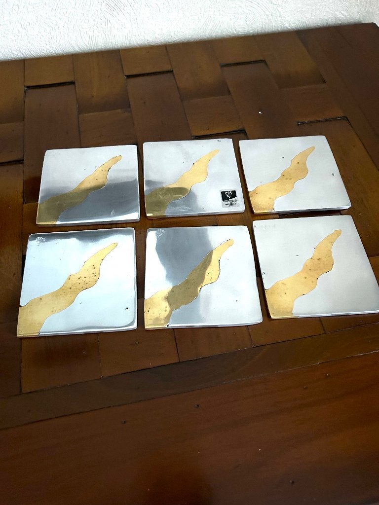 Onderzetter van gepolijst aluminium . Alfonso Márquez, Huis en Inrichting, Woonaccessoires | Onderzetters, Ophalen, Gebruikt, Glasonderzetter