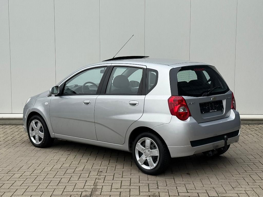 ✅Chevrolet Aveo 1.2 i GARANTIE Airco Trekhaak Open Dak 1.Eig, Auto's, Chevrolet, Voorwielaandrijving, 1206 cc, Stof, 4 cilinders