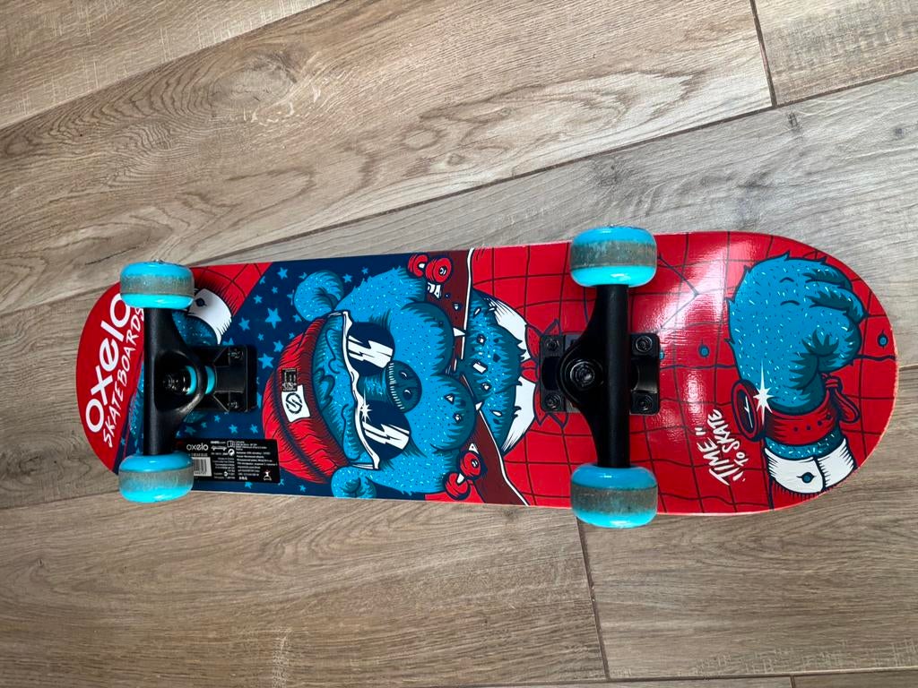Skateboard oxelo bleu rouge, Enlèvement, Utilisé, Skateboard