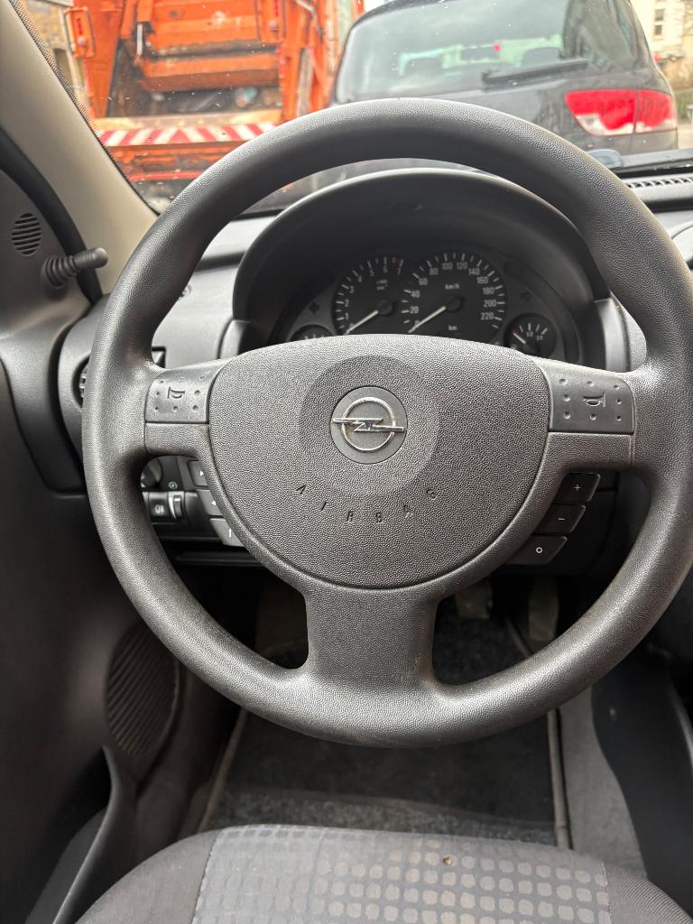 Opel Corsa 1.2 benzine 2004, Auto's, Stof, Euro 4, Zilver of Grijs, Corsa
