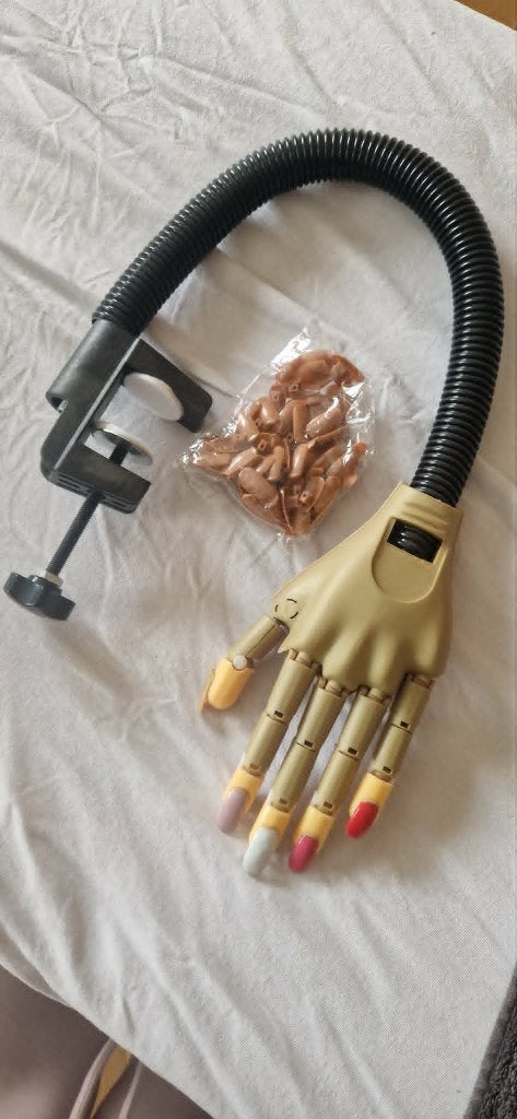 Nailtrainer oefenhand, Ophalen