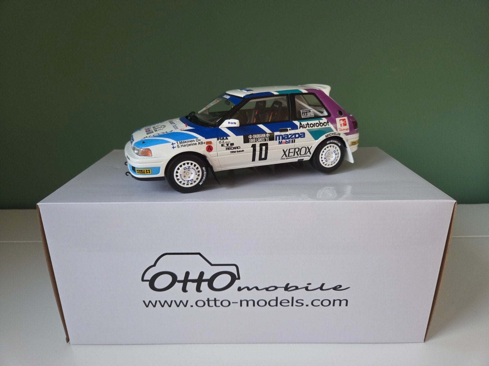 Otto Mobile Mazda 323 GTX GR.A Rallye (OT1099) 1:18 à vendre, Enlèvement ou Envoi, Neuf, Voiture, OttOMobile