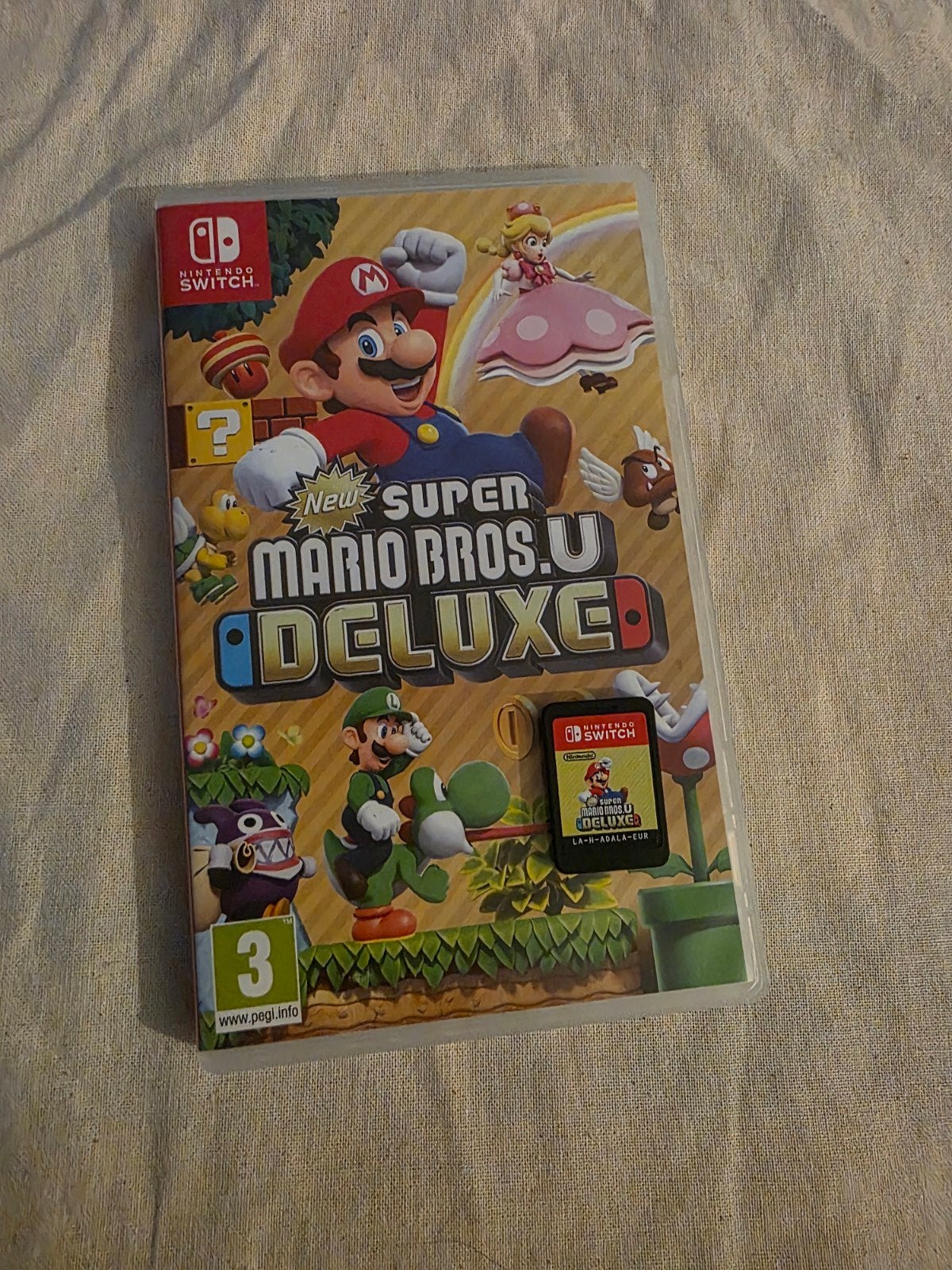 Nouveau Super Mario Bros. U Deluxe pour Nintendo Switch, Consoles de jeu & Jeux vidéo, Enlèvement ou Envoi, Comme neuf, À partir de 3 ans