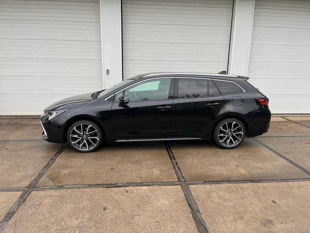 Toyota Corolla TS Premium 2.0 Hybride, Auto's, Toyota, 4 cilinders, Zwart, Leder, Bedrijf