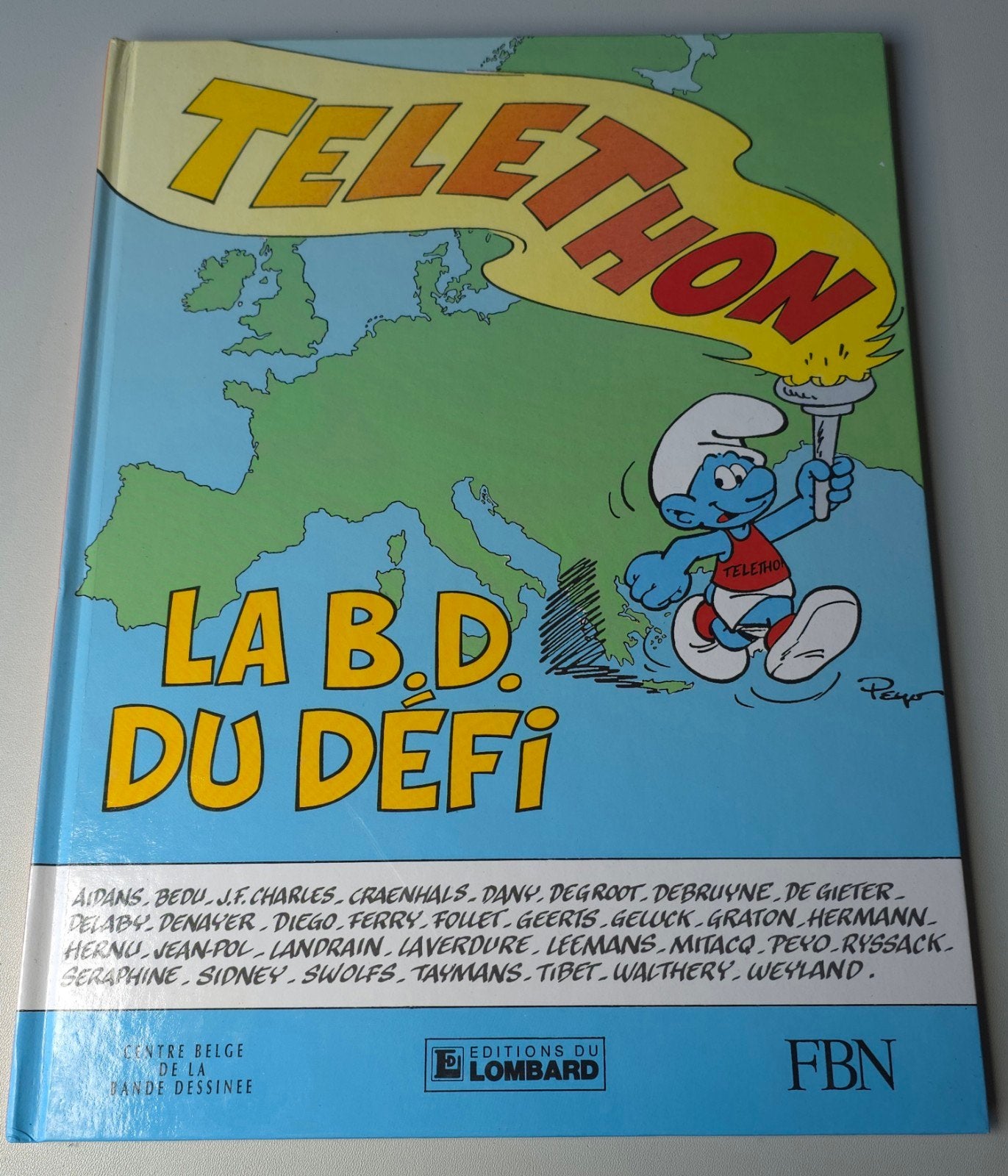 BD spéciale Schtroumpf Telethon, Verzamelen, Smurfen, Verzenden, Gebruikt, Verschillende Smurfen, Stripboek