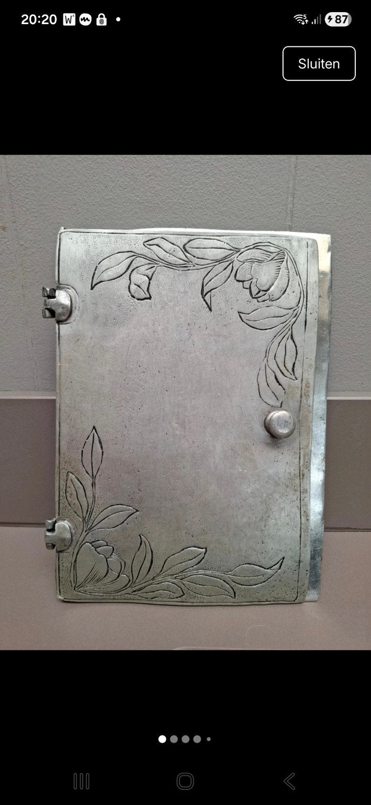 Tinnen boek cover, Ophalen