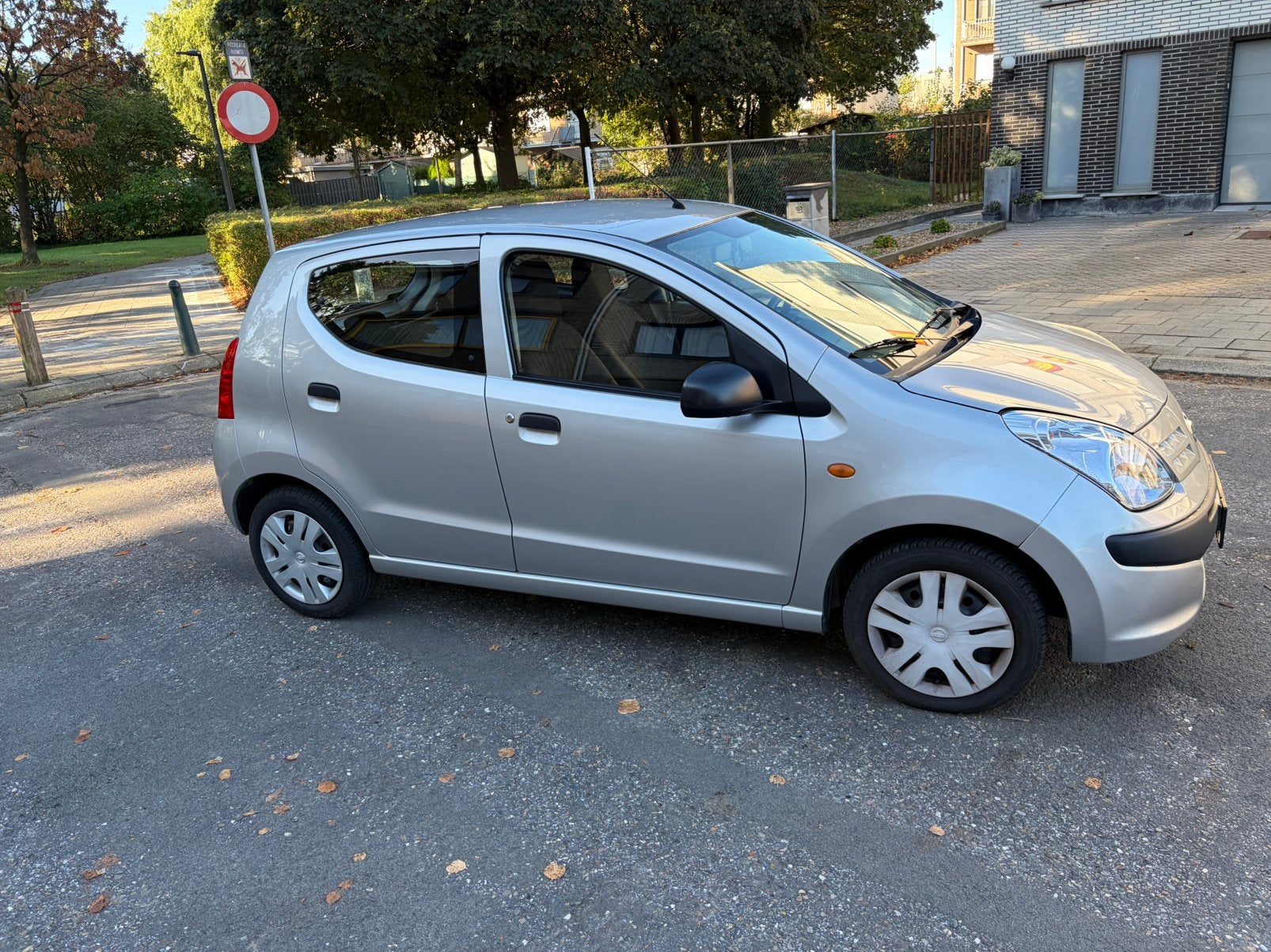 Nissan Pixo 1.0 benz 103506 km 2012 garantie, Auto's, Stof, 50 kW, Zwart, Handgeschakeld
